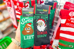 hand holding up christmas socks at dollar tree