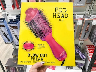 hand holding out bed head box in Target aisle