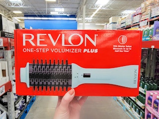 hand holding a revlon volumizer