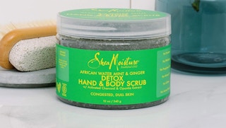 a jar of sheamoisture body scrub on a counter