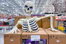 giant ground breaking skeleton display in store