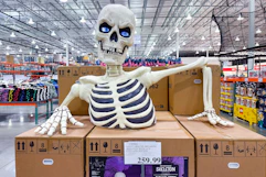 giant ground breaking skeleton display in store