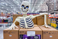 giant ground breaking skeleton display in store
