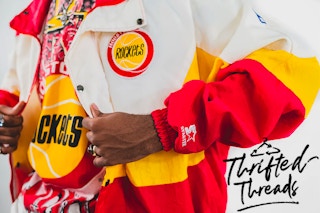 A close up on a vintage jacket with the Thrifted Threads logo