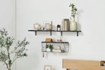 Three floating shelves on a wall
