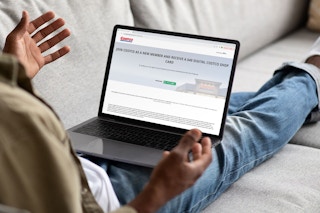 A person looking at the costco military promotion