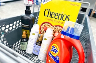 tresemme shampoo, sheamoisture hair oil, dove whole body deodorant, tide detergent, and cheerios cereal in a cart