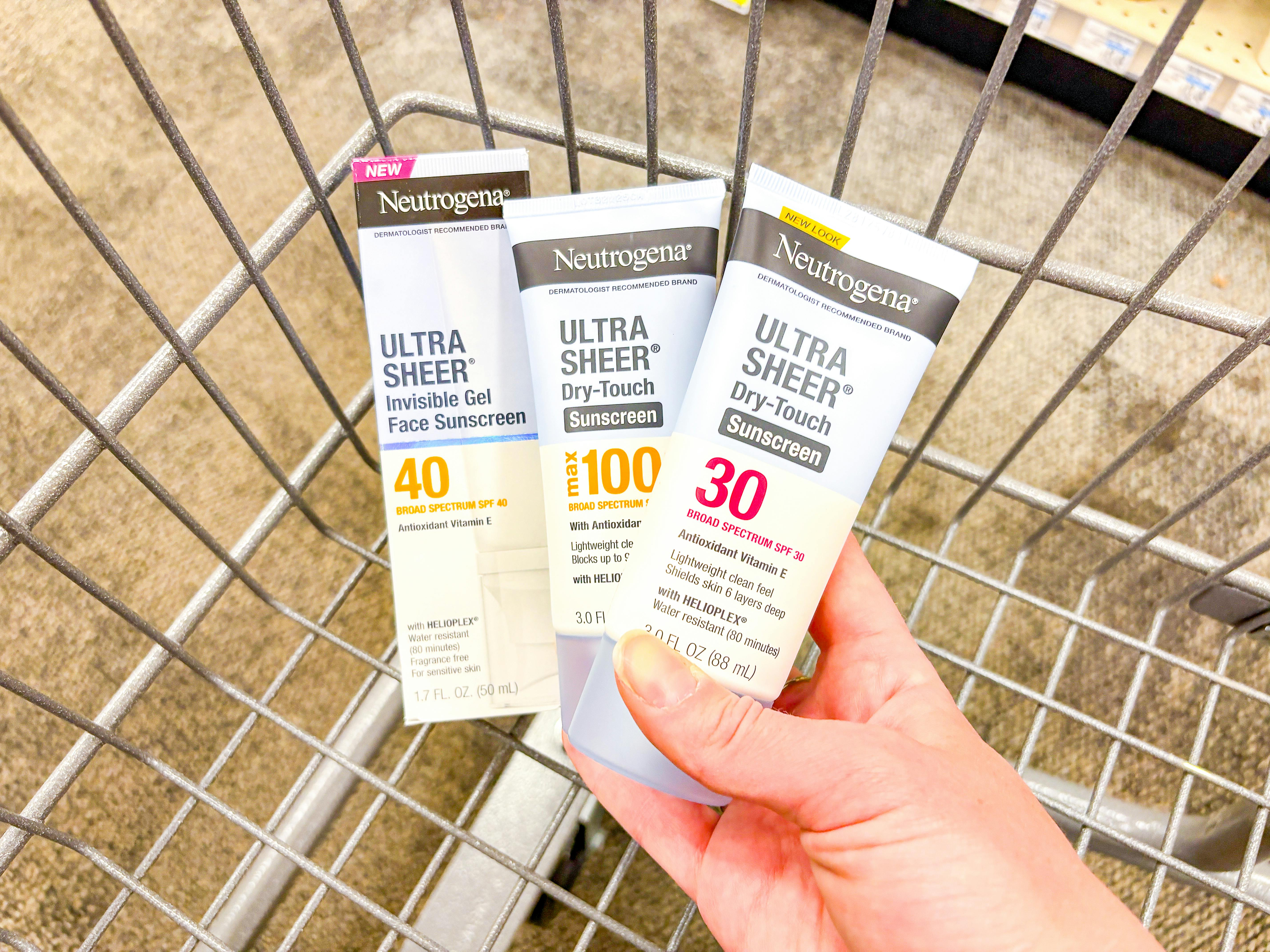 hand holding neutrogena sunscreen in cvs