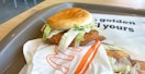 A Grand McChicken sandwich from McDonald's on a tray