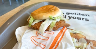 A Grand McChicken sandwich from McDonald's on a tray