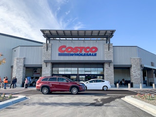 A Costco storefront on a sunny day.