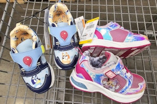 bluey and minnie mouse light up shoes in a cart