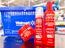 three cantu hair care items on table in front of walmart hand cart