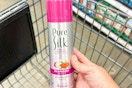 hand holding a can of pure silk shaving cream