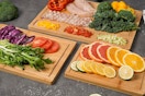 cutting boards on a table with food