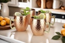 Set of four Moscow mule mugs.
