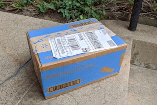 A Walmart package sitting on a doorstep