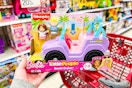 hand holding a little people barbie beach cruiser at target