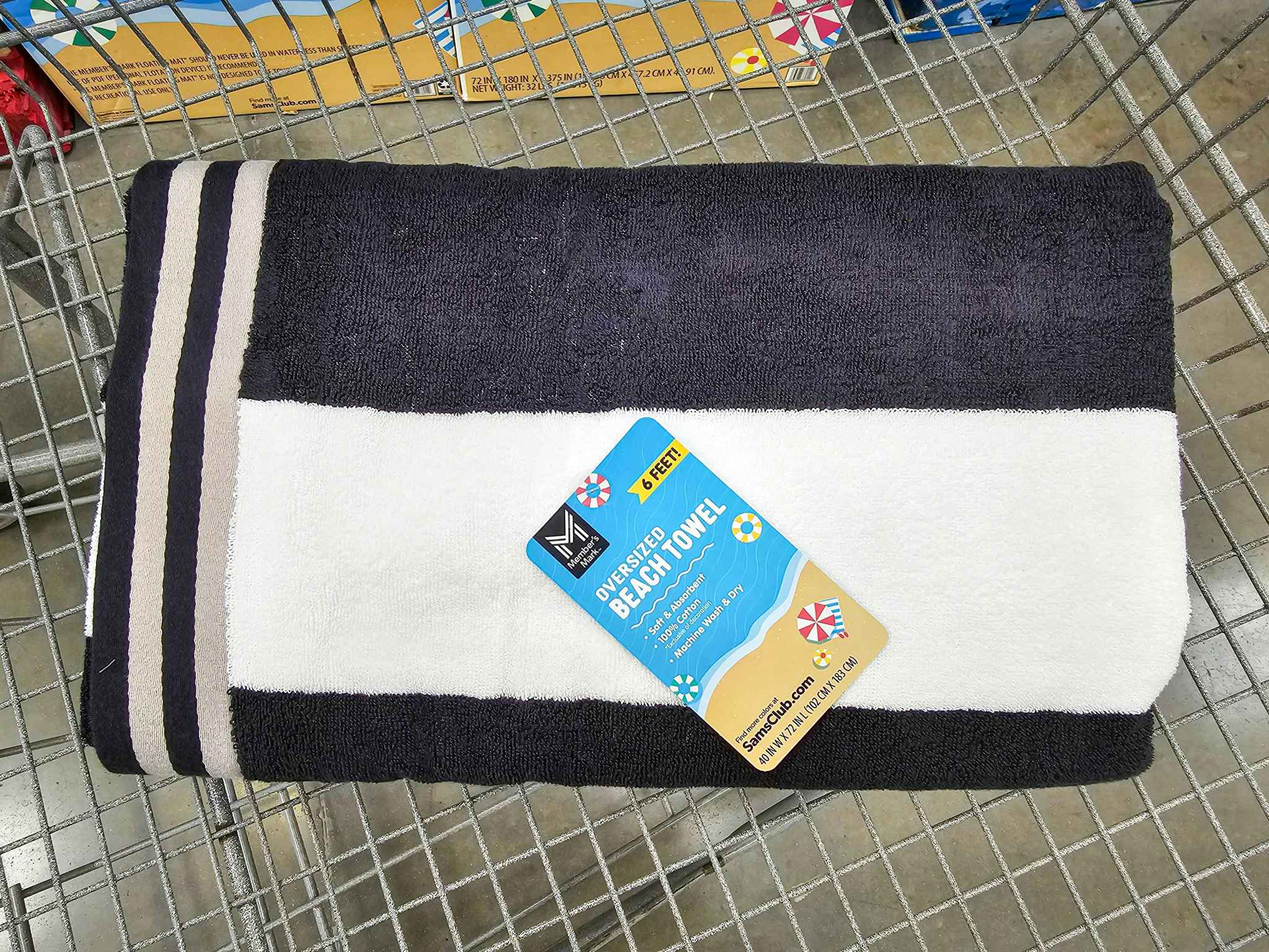 black and white beach towel in a cart