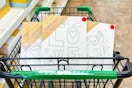 dollar tree canvases in a shopping cart