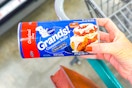 hand holding a can of pillsbury cinnamon rolls