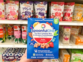 hand holding SpoonfulONE snack in front of Target shelf