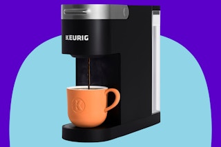 Keurig K-Slim Single Serve K-Cup Pod Coffee Maker on a blue background.