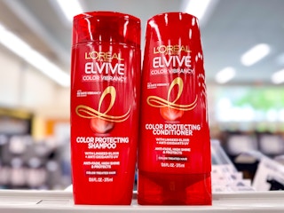 close-up view of two bottles of l'oreal elvive hair care on a store shelf