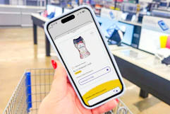 hand holding a smartphone displaying a kcl app 1-clip coupon for downy