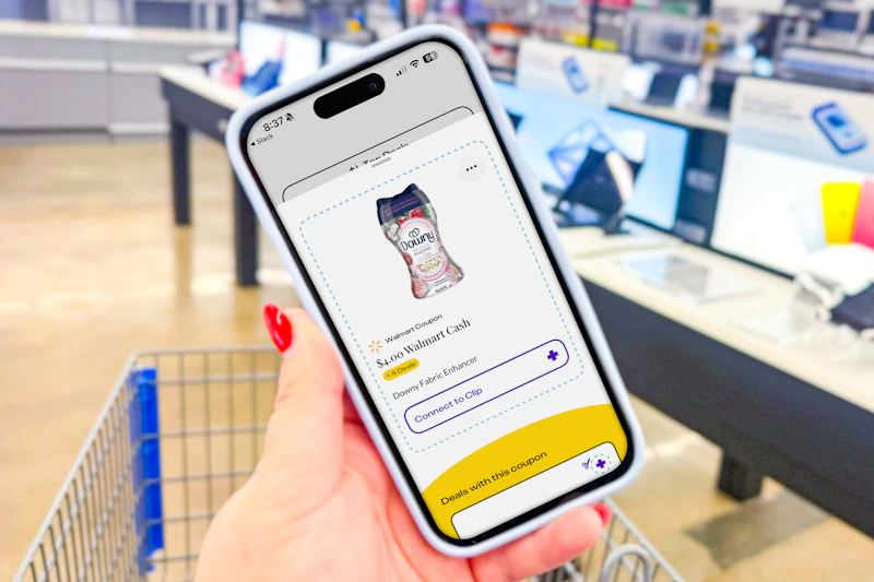 hand holding a smartphone displaying a kcl app 1-clip coupon for downy