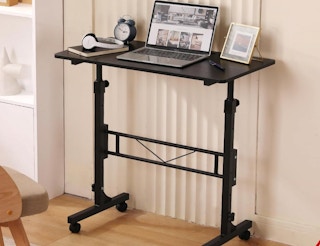 a person on a walking pad while working at a desk