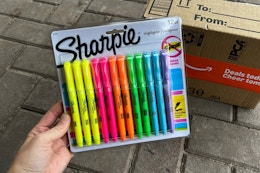 Sharpie highlighter being held in front of Prime box