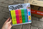 Sharpie highlighter being held in front of Prime box