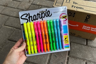Sharpie highlighter being held in front of Prime box
