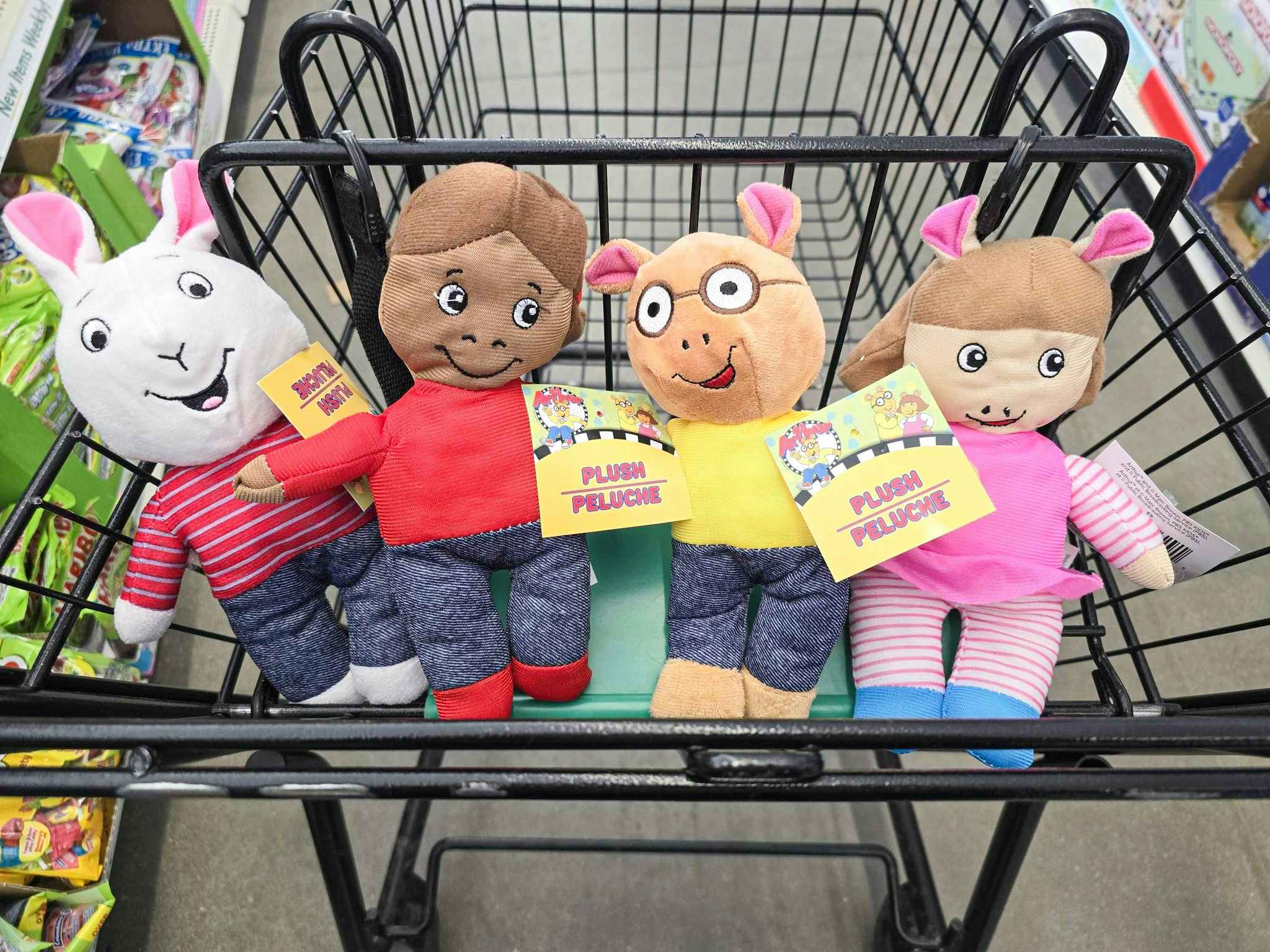 4 arthur plushes in a cart