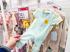 hand holding cloud island baby apparel at target