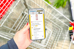 hand holding a smartphone displaying a 1-clip deal in the kcl app