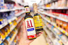 hand holding lea and perrins and a.1. sauces