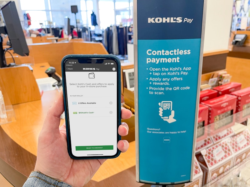 A cell phone with Kohl's pay promotions on the screen need checkout