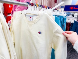 champion sweatshirts sitting on a target rack