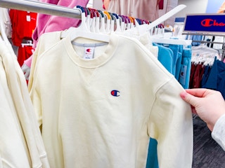 champion sweatshirts sitting on a target rack