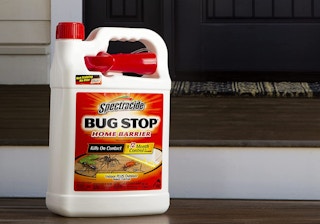 bug spray sitting on wooden steps