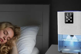 a woman sleeping near a dehumidifier