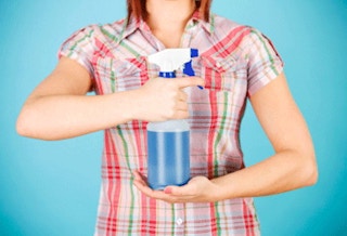Woman with spray bottle