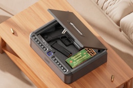 BILLCONCH Gun Safe for Handgun Biometric Gun Safe sitting on a coffee table.