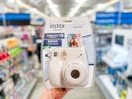 hand holding instax mini 7 camera bundle at walmart