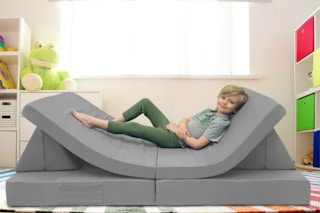 lifestyle image of a child on a play couch