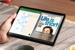 Man holding an Amazon Fire tablet.