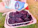 pouring Clorox bleach on tie dye clothes