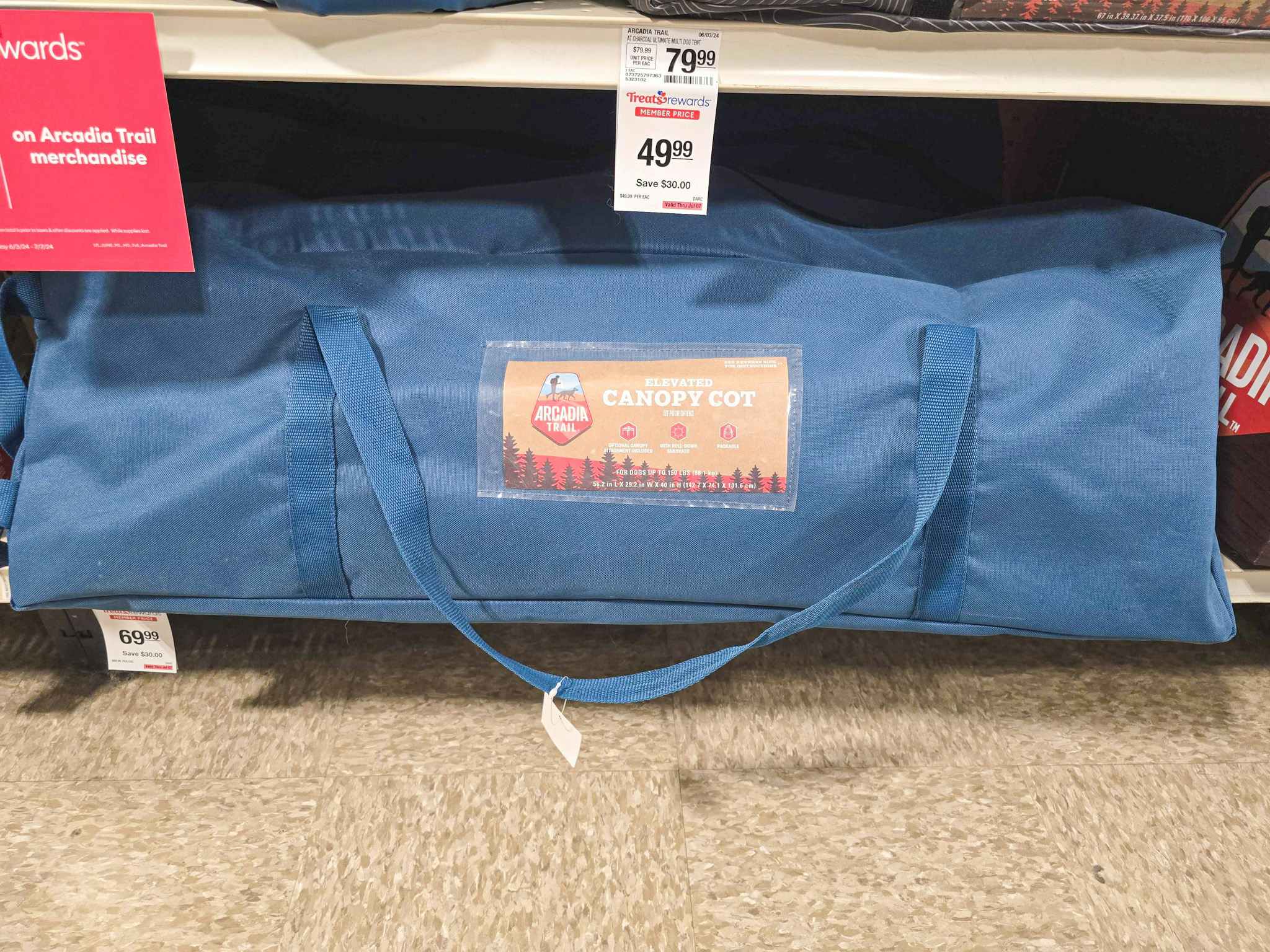 canopy cot for pets in a bag on a shelf